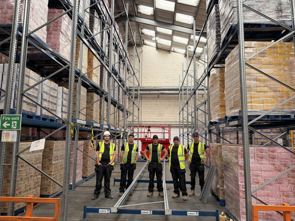 SEIRS engineers replacing damaged pallet racking uprights in warehouse